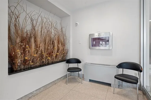 a bedroom with a bed and a chair