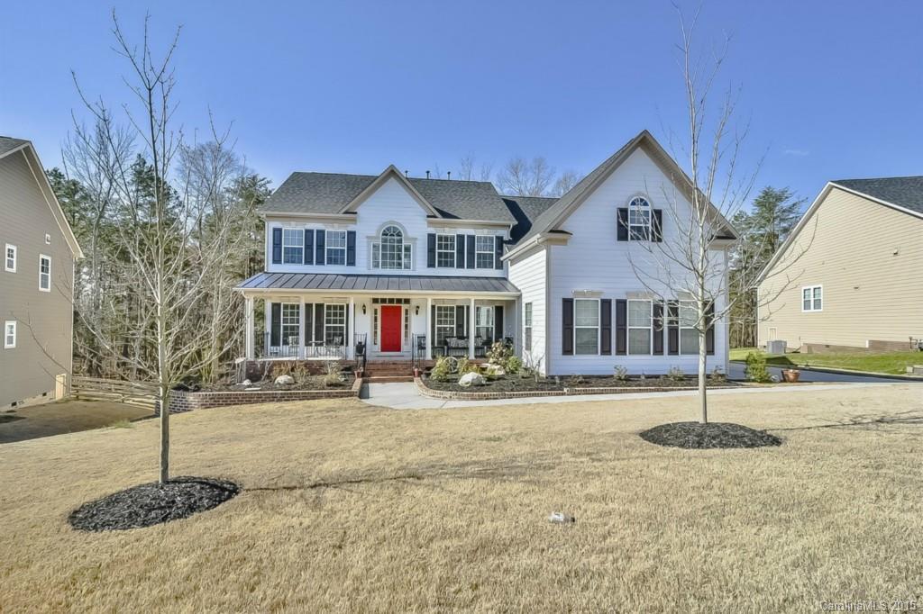 315 Calming Way Tega Cay, SC 29708 - Photo 1 of 24 a front view of a house with garden
