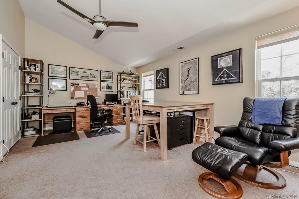 315 Calming Way Tega Cay, SC 29708 - Photo 18 of 24 a view of a livingroom with furniture and a fireplace