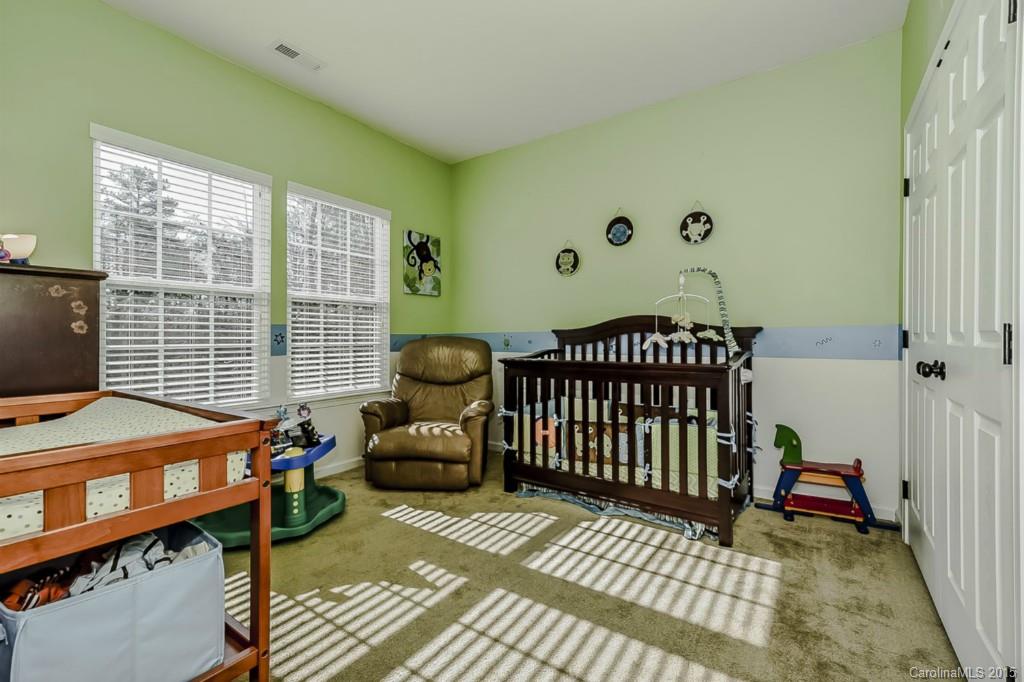 315 Calming Way Tega Cay, SC 29708 - Photo 19 of 24 a bedroom with furniture and a window