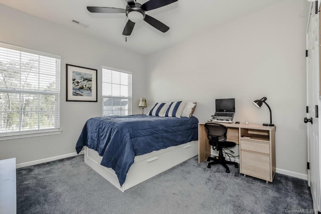 315 Calming Way Tega Cay, SC 29708 - Photo 20 of 24 a spacious bedroom with a bed and a desk