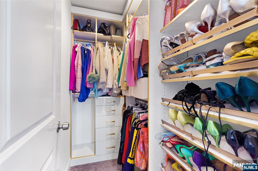 506 Brooklyn Mountain Road Hopatcong, NJ 07843 - Photo 13 of 30 a view of walk in closet with clothes and shoes