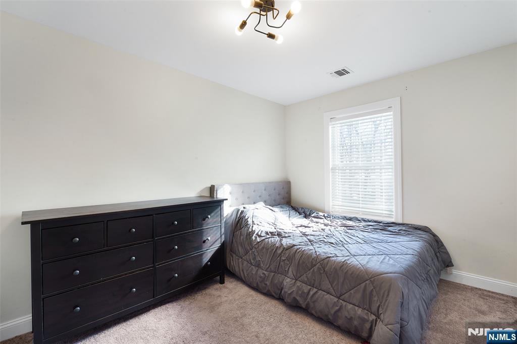 506 Brooklyn Mountain Road Hopatcong, NJ 07843 - Photo 15 of 30 a bedroom with a bed and a window