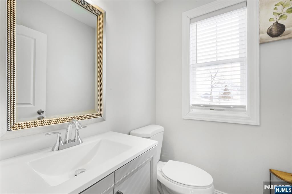 506 Brooklyn Mountain Road Hopatcong, NJ 07843 - Photo 20 of 30 a bathroom with a sink vanity mirror and toilet
