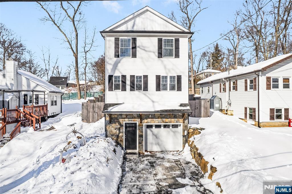506 Brooklyn Mountain Road Hopatcong, NJ 07843 - Photo 2 of 30 a view of a white house with large windows