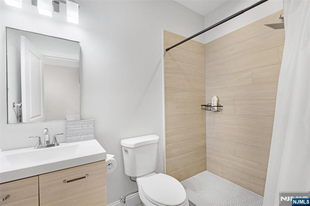 506 Brooklyn Mountain Road Hopatcong, NJ 07843 - Photo 30 of 30 a bathroom with a sink toilet and shower