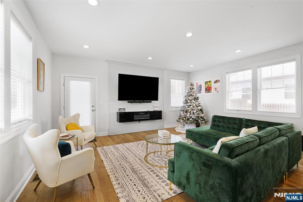 506 Brooklyn Mountain Road Hopatcong, NJ 07843 - Photo 4 of 30 a living room with furniture and a flat screen tv