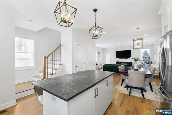 a kitchen with a table chairs and microwave