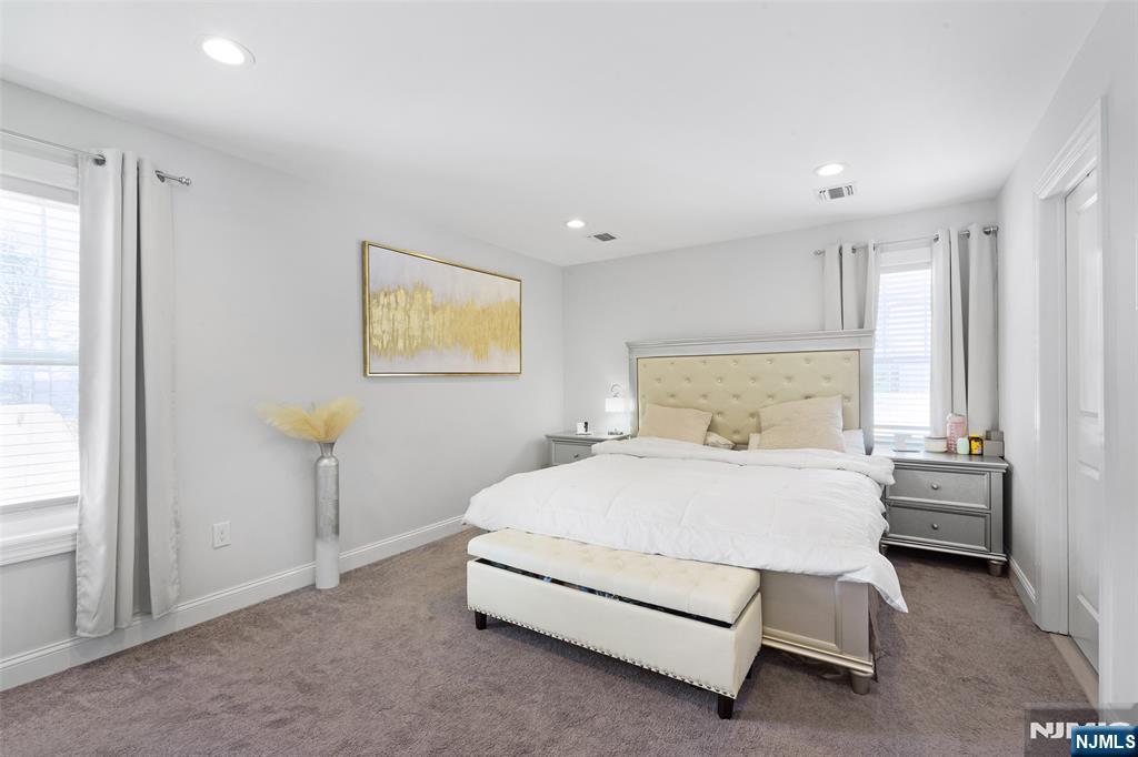 506 Brooklyn Mountain Road Hopatcong, NJ 07843 - Photo 10 of 30 a bedroom with a bed and a window