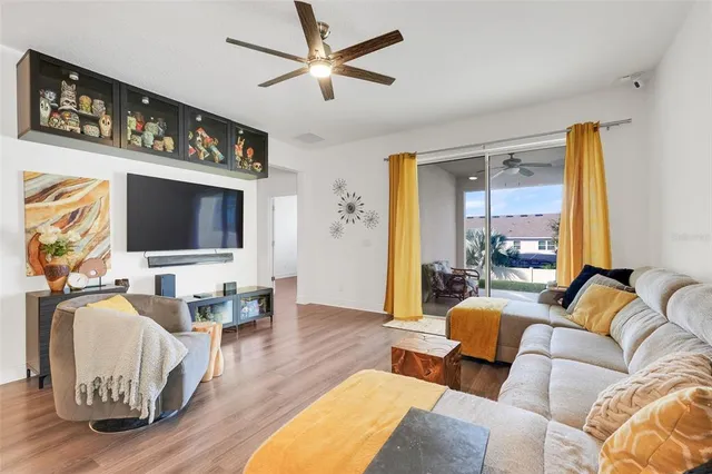 a living room with furniture fireplace and a flat screen tv