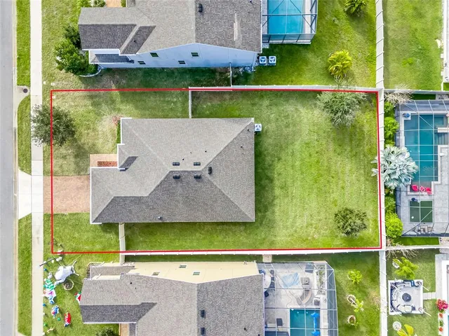 an aerial view of a house with a garden