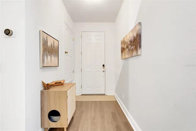 a view of storage and utility room with wooden floor