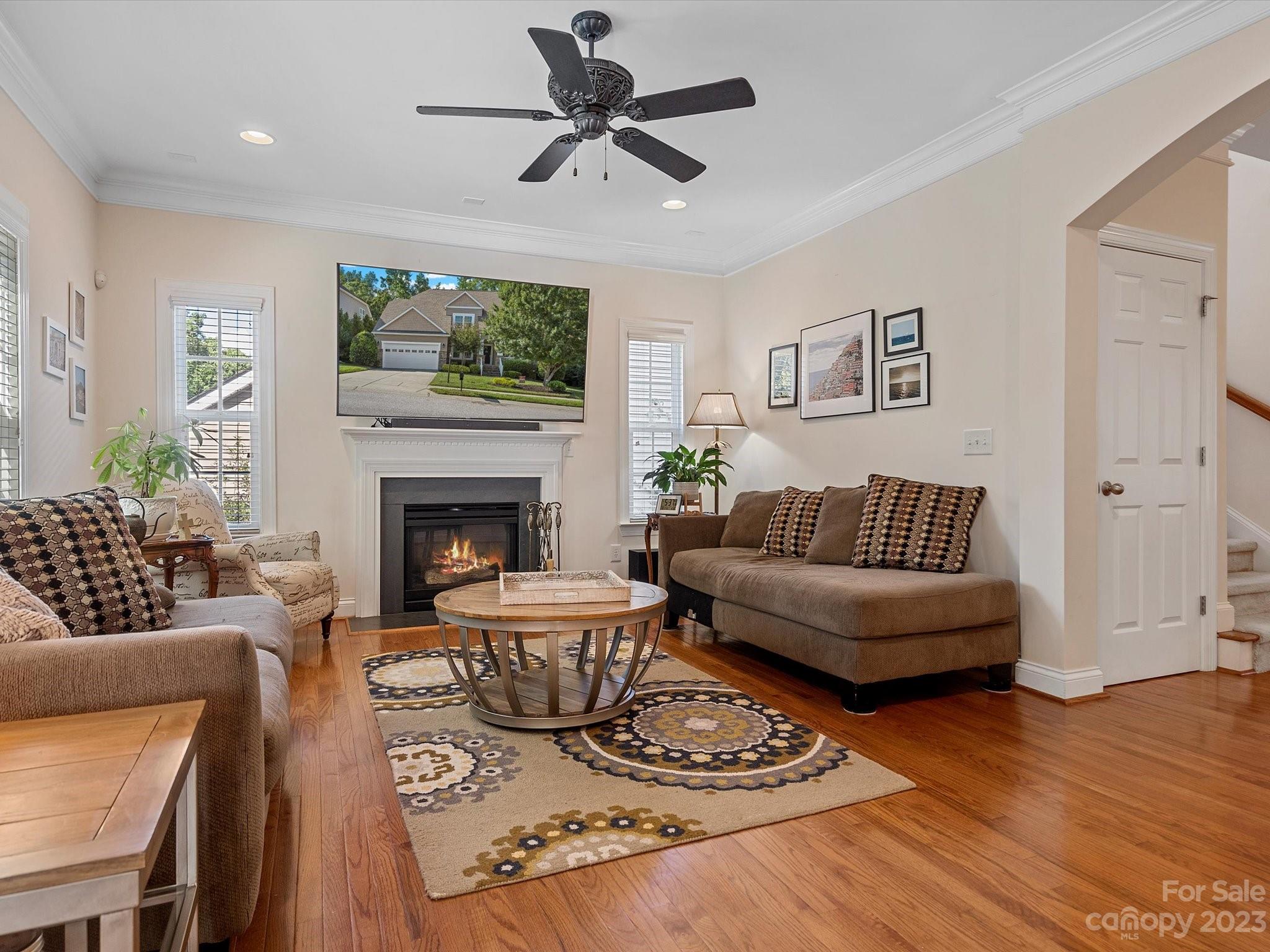4136 Sunset Ridge Drive Rock Hill, SC 29732 - Photo 13 of 44 a living room with furniture a flat screen tv and a fireplace