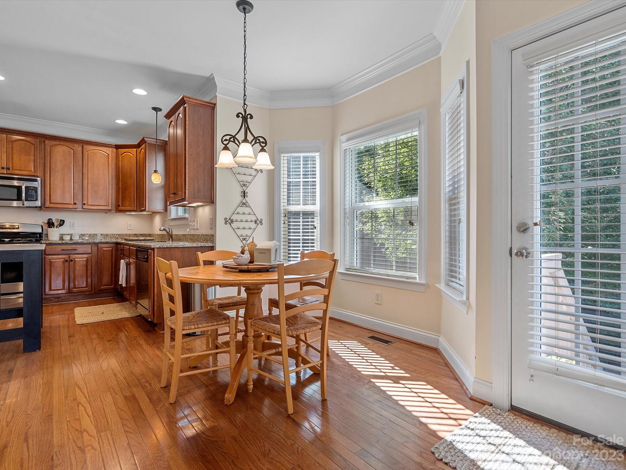 4136 Sunset Ridge Drive Rock Hill, SC 29732 - Photo 17 of 44 a view of a dining room with furniture window and wooden floor