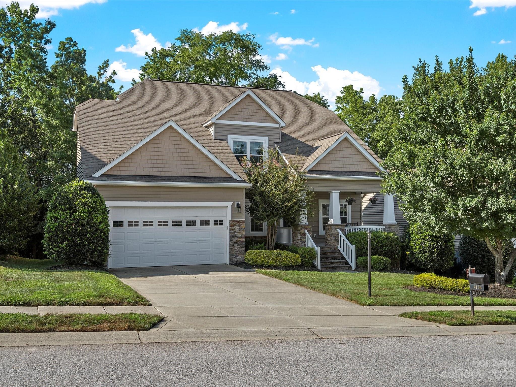 4136 Sunset Ridge Drive Rock Hill, SC 29732 - Photo 2 of 44 a front view of a house with a yard and garage
