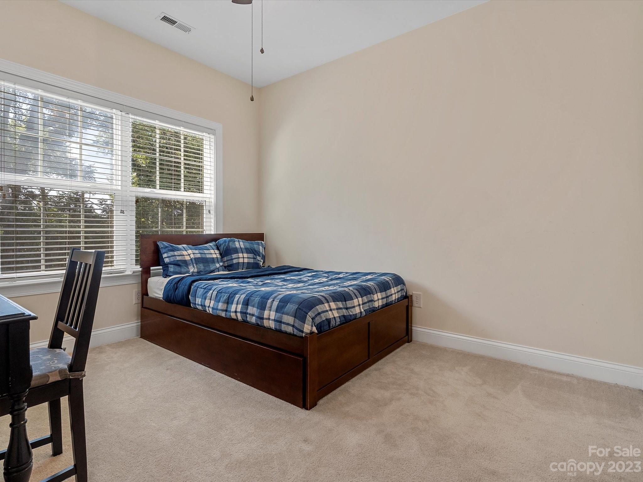 4136 Sunset Ridge Drive Rock Hill, SC 29732 - Photo 26 of 44 a bedroom with a bed wooden floor and a window