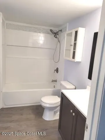 a bathroom with a sink a toilet and a bathtub