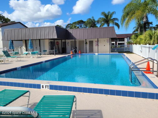 732 Ridge Club Drive, Unit 49 Melbourne, FL 32934 - Photo 19 of 20 a view of a house with backyard and swimming pool