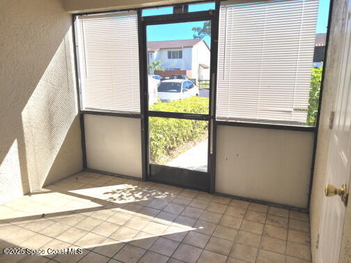 732 Ridge Club Drive, Unit 49 Melbourne, FL 32934 - Photo 4 of 20 a view of an empty room with a window