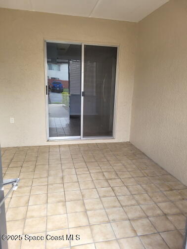 732 Ridge Club Drive, Unit 49 Melbourne, FL 32934 - Photo 5 of 20 a view of an empty room and window