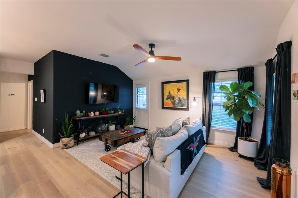 204 Main Street Haslet, TX 76052 - Photo 14 of 36 a living room with furniture and a flat screen tv