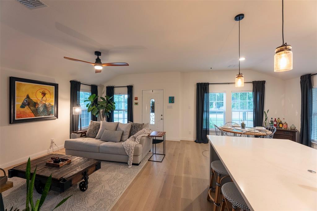204 Main Street Haslet, TX 76052 - Photo 18 of 36 a living room with furniture and a chandelier