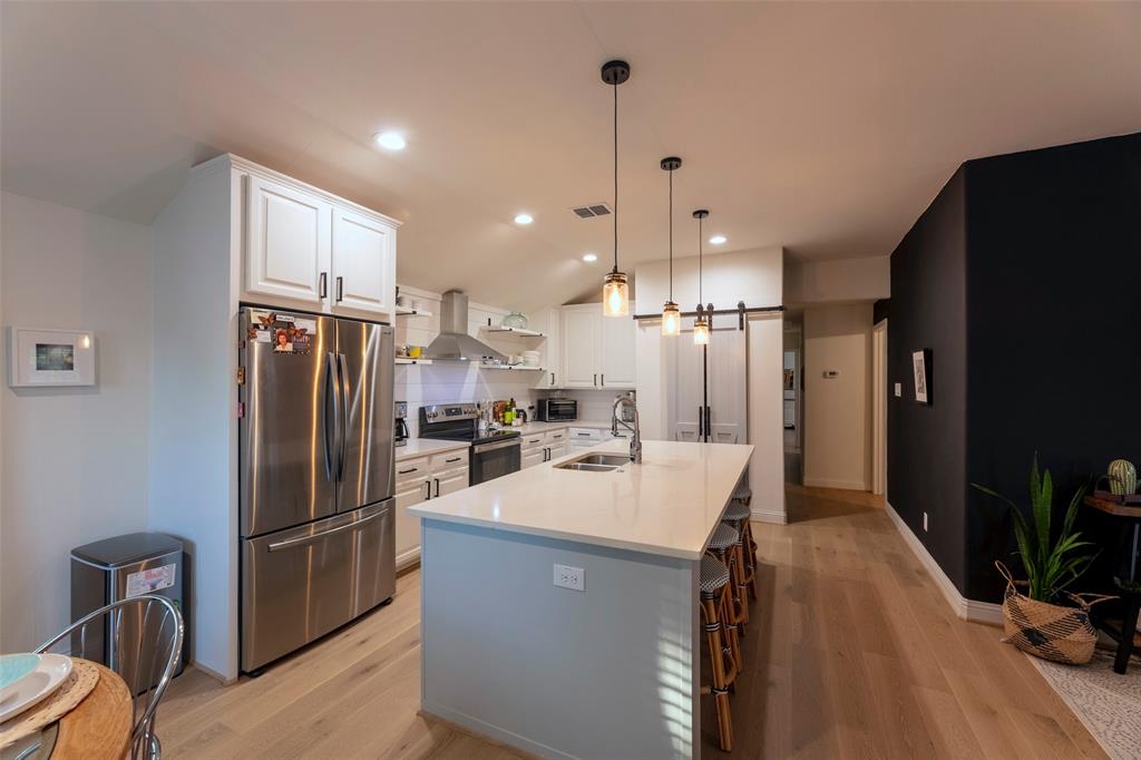 204 Main Street Haslet, TX 76052 - Photo 21 of 36 a kitchen with refrigerator and countertop