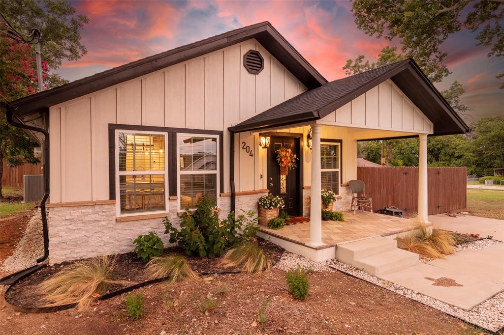 204 Main Street Haslet, TX 76052 - Photo 7 of 36 a backyard of a house with seating space