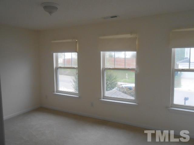 4113 Hopper Street Raleigh, NC 27616 - Photo 11 of 15 an empty room with windows