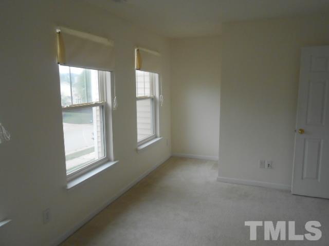 4113 Hopper Street Raleigh, NC 27616 - Photo 12 of 15 an empty room with windows