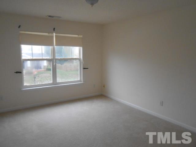 4113 Hopper Street Raleigh, NC 27616 - Photo 13 of 15 an empty room with a window