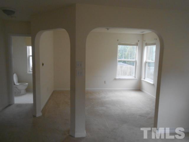 4113 Hopper Street Raleigh, NC 27616 - Photo 5 of 15 a view of an empty room and a gallery