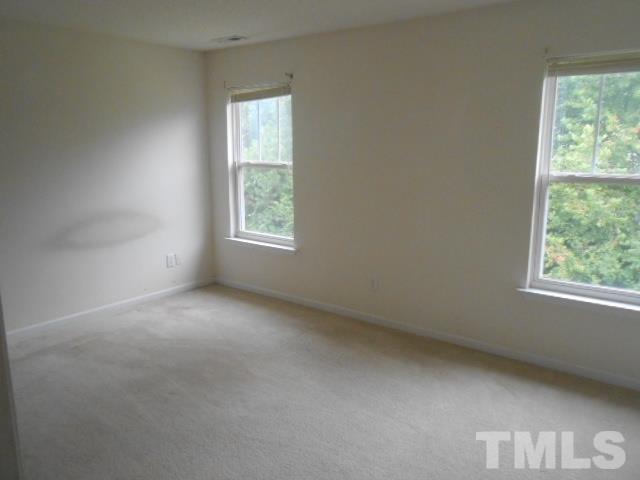 4113 Hopper Street Raleigh, NC 27616 - Photo 7 of 15 an empty room with windows