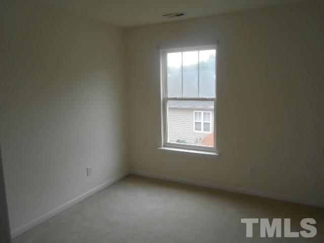 4113 Hopper Street Raleigh, NC 27616 - Photo 9 of 15 an empty room with a window