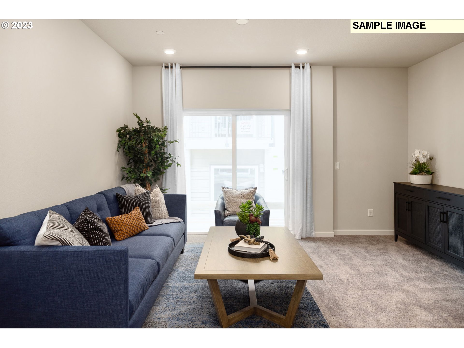 12011 Southeast High Creek Road, Unit C Happy Valley, OR 97086 - Photo 9 of 20 a living room with furniture potted plant and a window