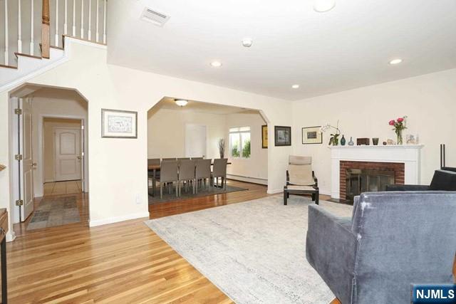84 12th Street Cresskill, NJ 07626 - Photo 8 of 45 a living room with furniture and a fireplace