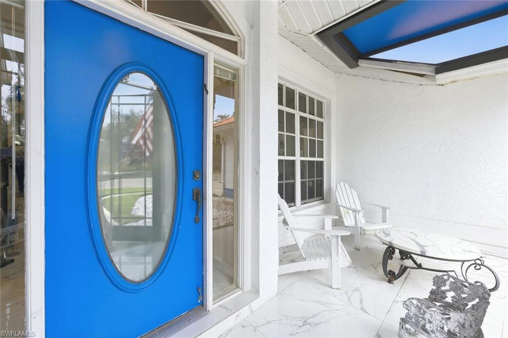 209 Countryside Drive Naples, FL 34104 - Photo 2 of 50 Entrance to property with stucco siding