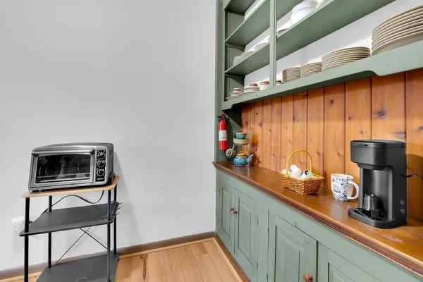 a kitchen with stainless steel appliances wooden cabinets and a stove top oven