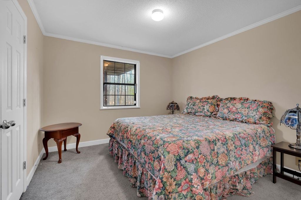 251 Bell Road Monteagle, TN 37356 - Photo 24 of 45 a bedroom with a bed and a window