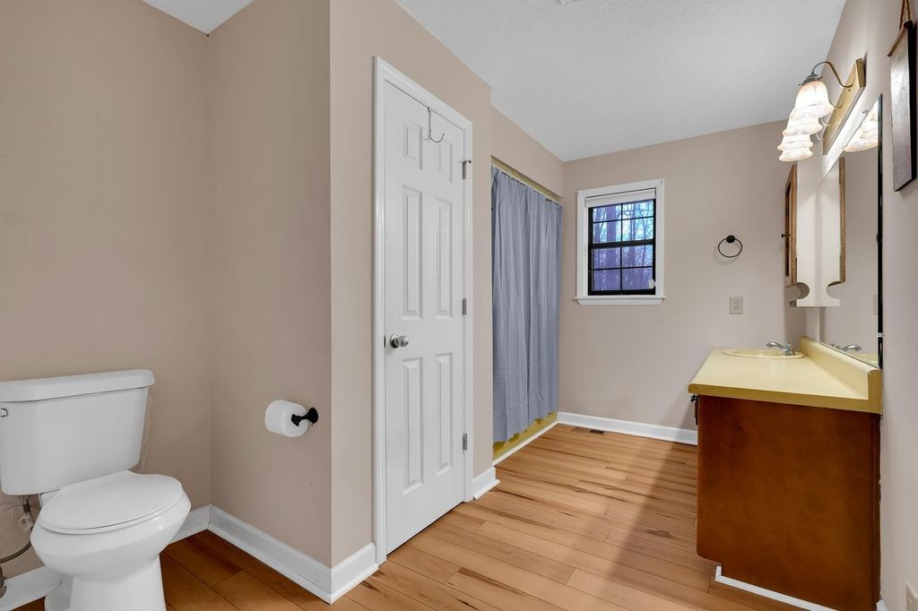 251 Bell Road Monteagle, TN 37356 - Photo 25 of 45 a bathroom with a sink a toilet and shower