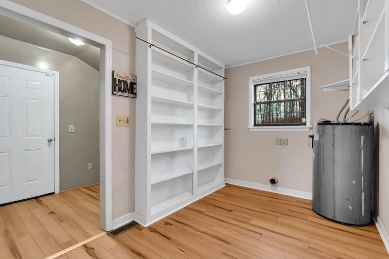 251 Bell Road Monteagle, TN 37356 - Photo 27 of 45 a view of empty room with wooden floor and entryway