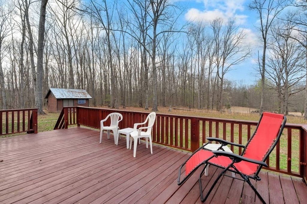 251 Bell Road Monteagle, TN 37356 - Photo 29 of 45 a view of a chairs and table on the wooden floor
