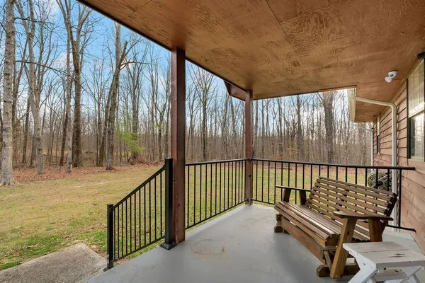 a view of a porch with wooden floor