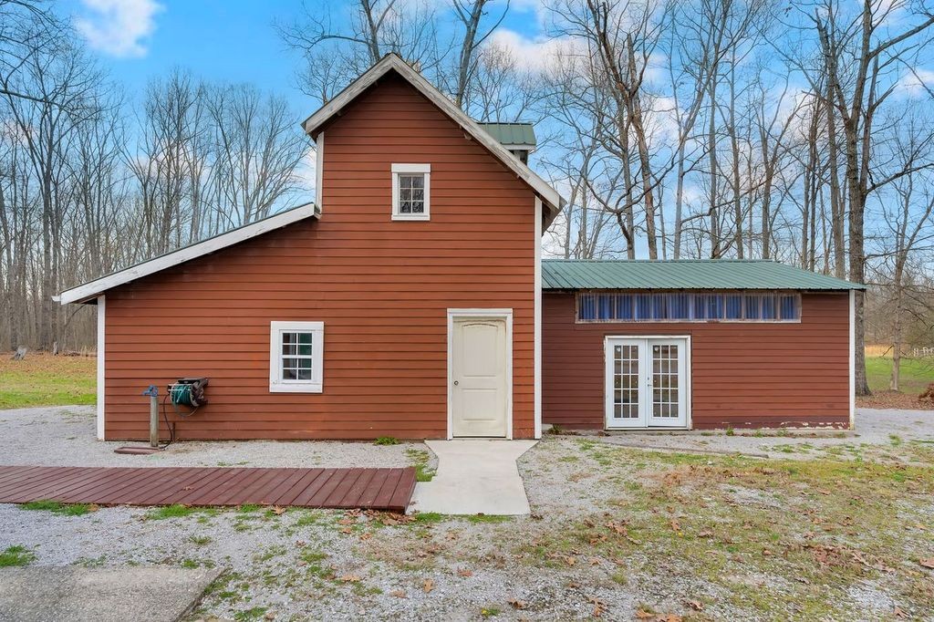 251 Bell Road Monteagle, TN 37356 - Photo 36 of 45 a front view of a house with a yard and garage