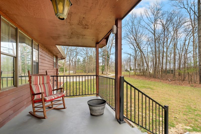 251 Bell Road Monteagle, TN 37356 - Photo 4 of 45 a view of a chairs in balcony