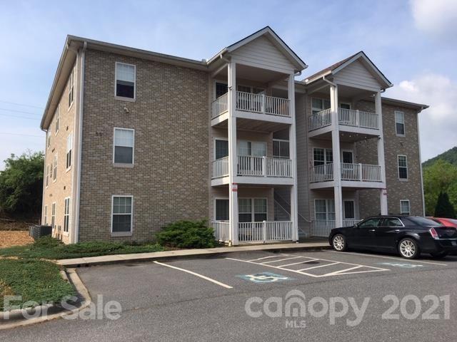 55 Derby Road, Unit 2D Cullowhee, NC 28723 - Photo 1 of 5 a front view of a building with a road