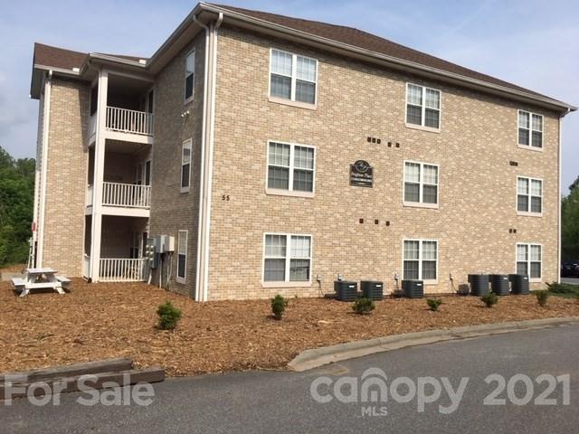 55 Derby Road, Unit 2D Cullowhee, NC 28723 - Photo 2 of 5 a front view of a house with a road