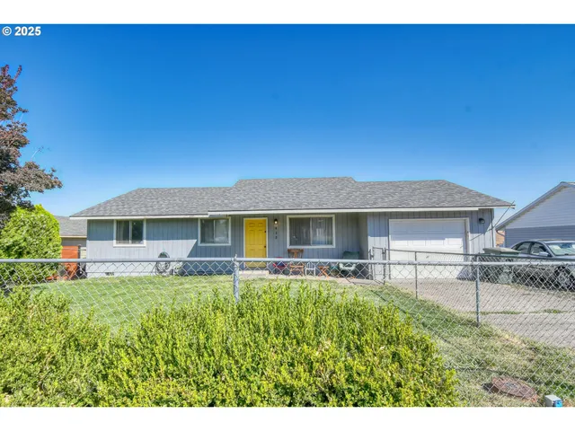 a house view with a garden space