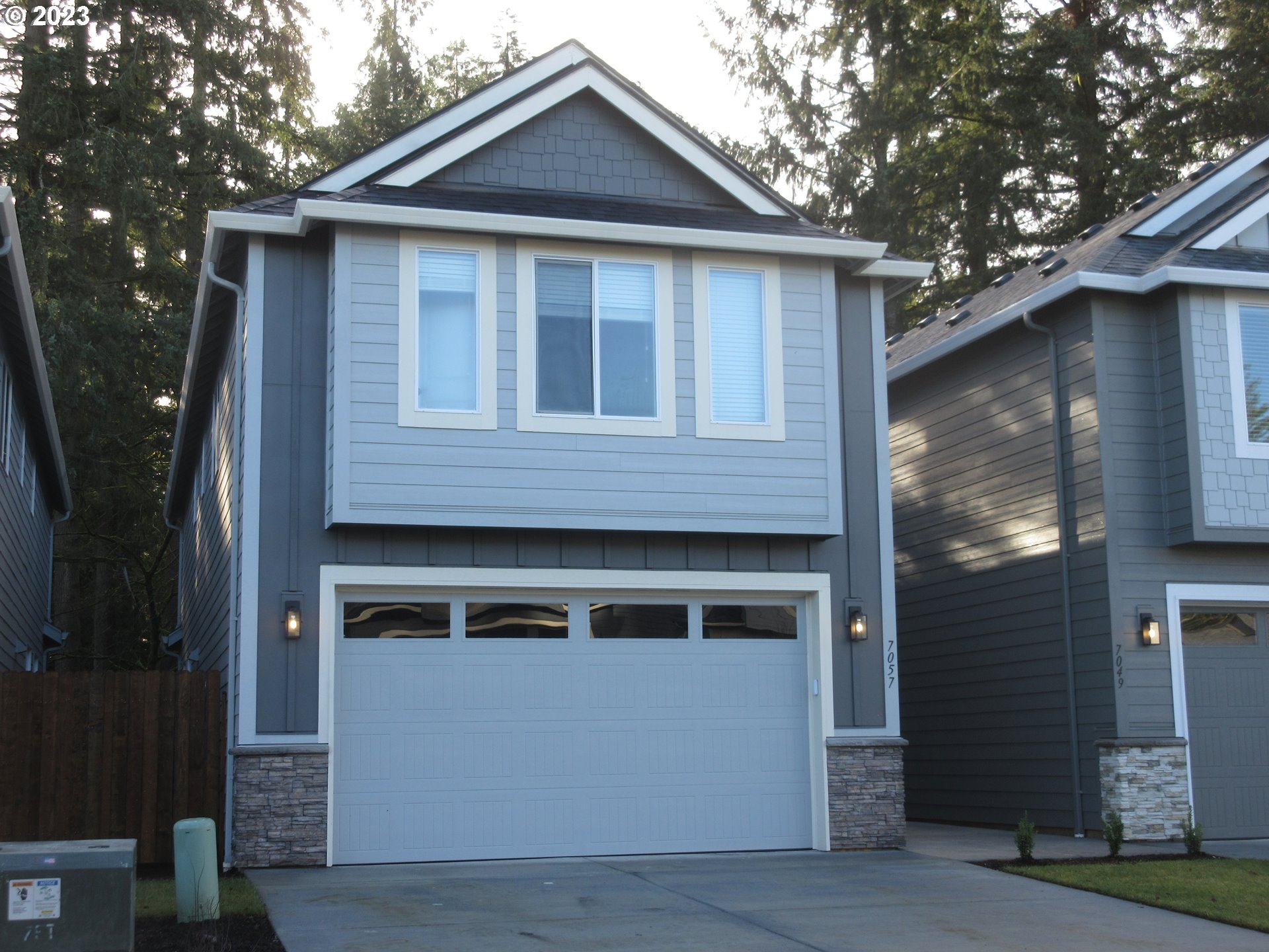7057 South 13th Street Ridgefield, WA 98642 - Photo 1 of 1 a front view of a house with a yard