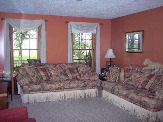 18108 Poplar Grove Road Poplar Grove, IL 61065 - Photo 3 of 7 a living room with couches and a large window